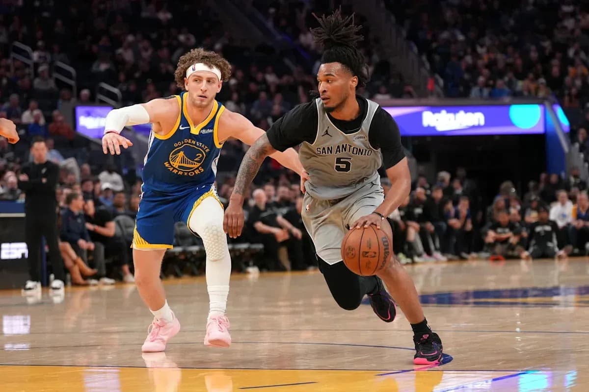 Player dribbling ball while being closely guarded Player dribbling ball while being closely guarded