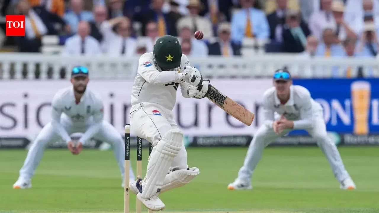 Batsman facing delivery with wicketkeeper and fielders nearby Batsman facing delivery with wicketkeeper and fielders nearby