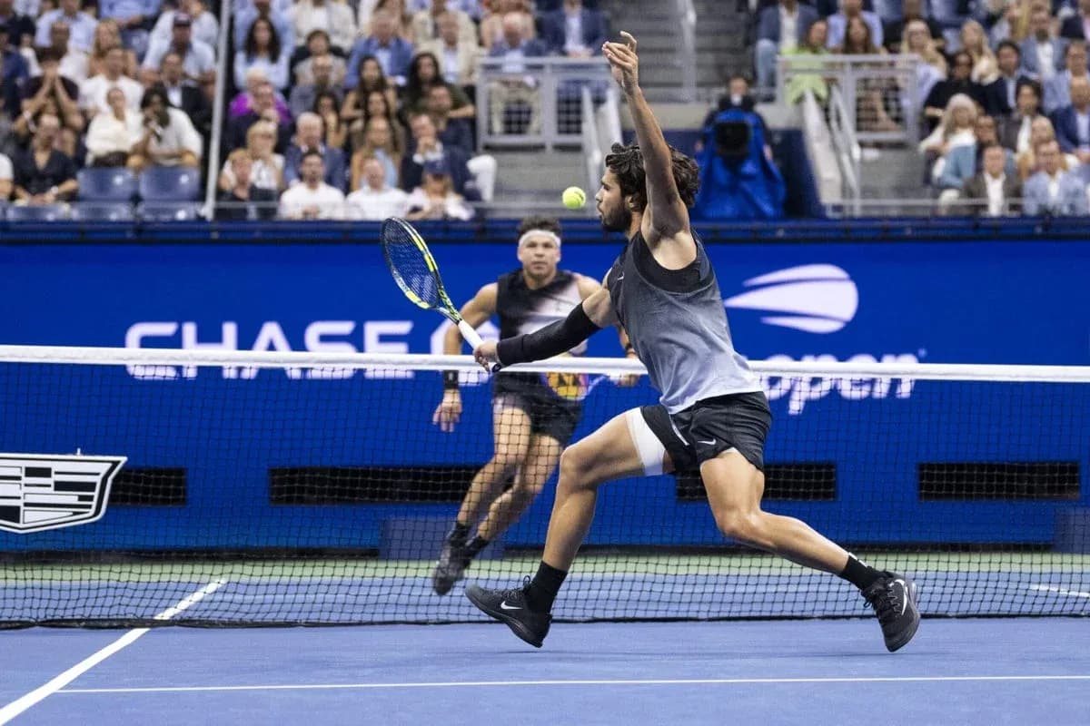 Player hitting a forehand during tennis match Player hitting a forehand during tennis match