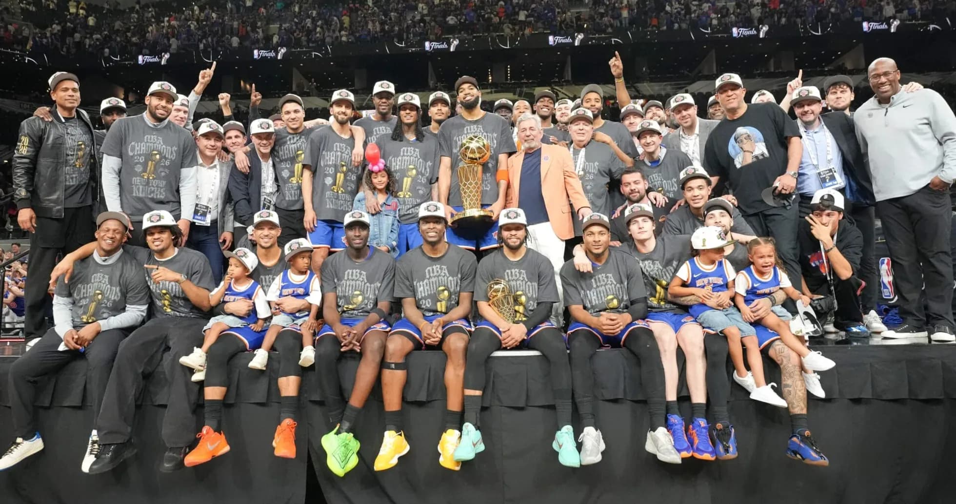 New York Knicks celebrating NBA Championship victory with trophy New York Knicks celebrating NBA Championship victory with trophy