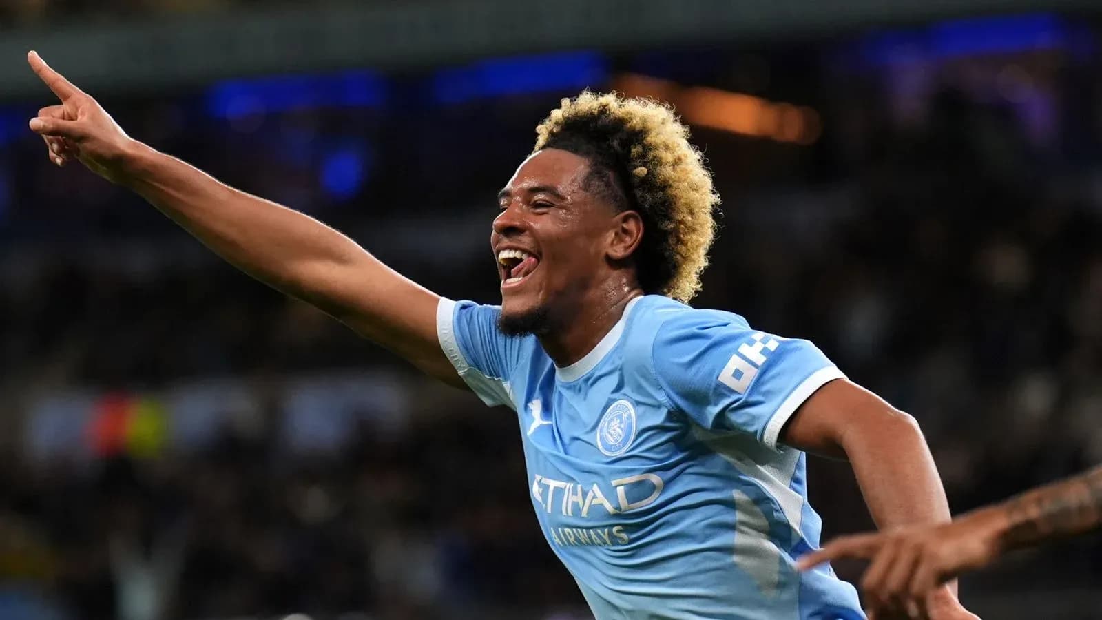 Player celebrating goal with raised finger during match Player celebrating goal with raised finger during match