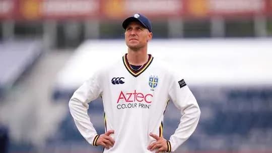 Cricketer wearing team kit looking upwards Cricketer wearing team kit looking upwards