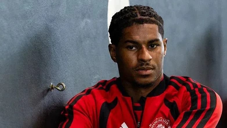 Player in Manchester United training kit posing indoors Player in Manchester United training kit posing indoors