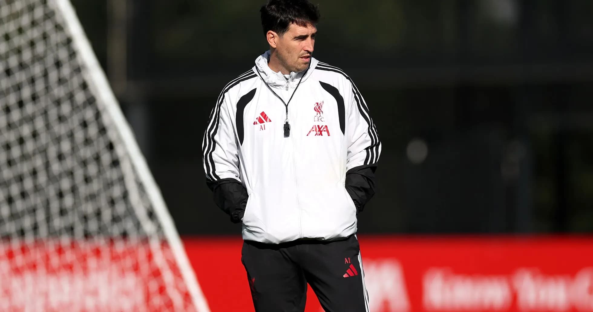 Coach observing players during training session at Liverpool Coach observing players during training session at Liverpool
