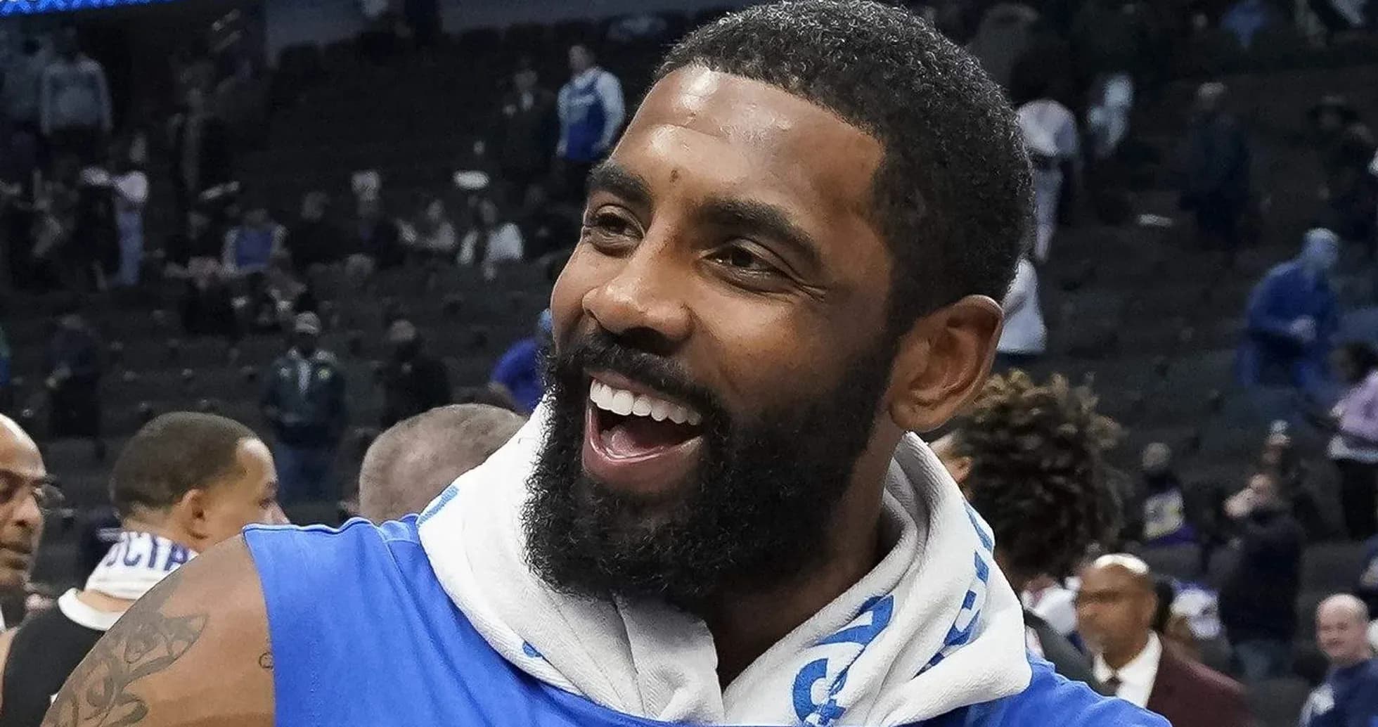 Player celebrating on court after a game Player celebrating on court after a game