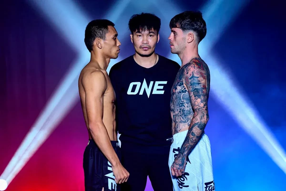 Two fighters facing off with a referee in between Two fighters facing off with a referee in between