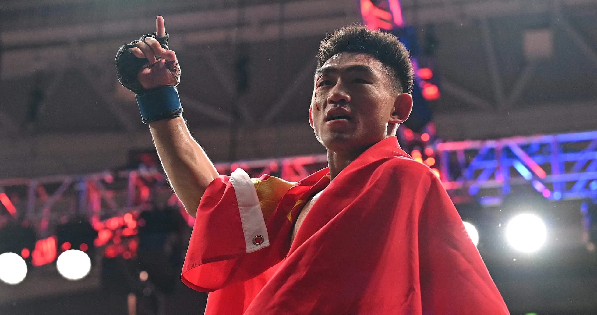 Boxer celebrating victory while holding up hand Boxer celebrating victory while holding up hand