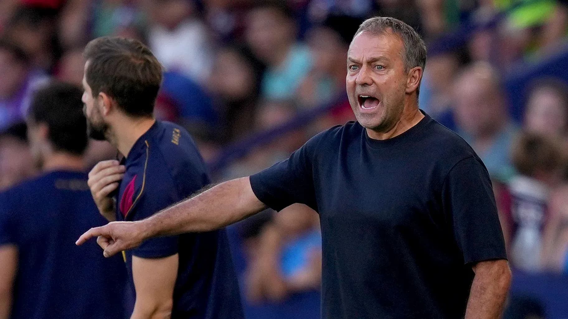 Coach shouting instructions from the sidelines during match Coach shouting instructions from the sidelines during match
