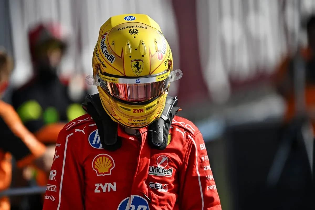 Racing driver in Ferrari uniform and helmet Racing driver in Ferrari uniform and helmet