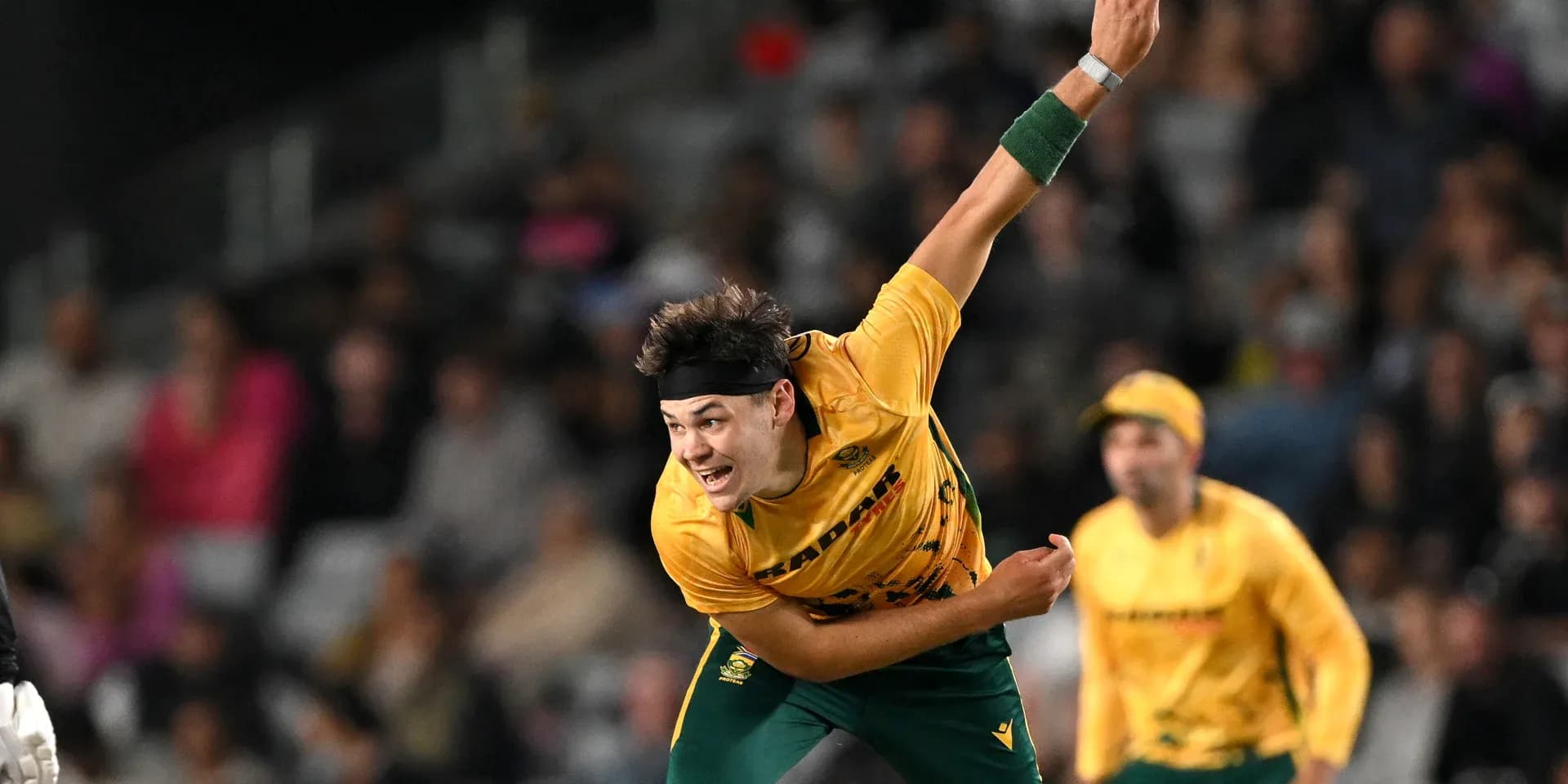 Bowler delivering ball during cricket match Bowler delivering ball during cricket match