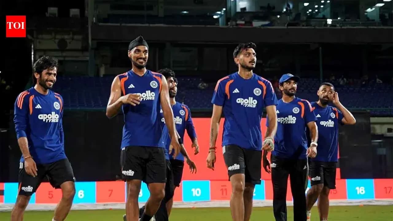 Cricket team players walking off the field after practice Cricket team players walking off the field after practice
