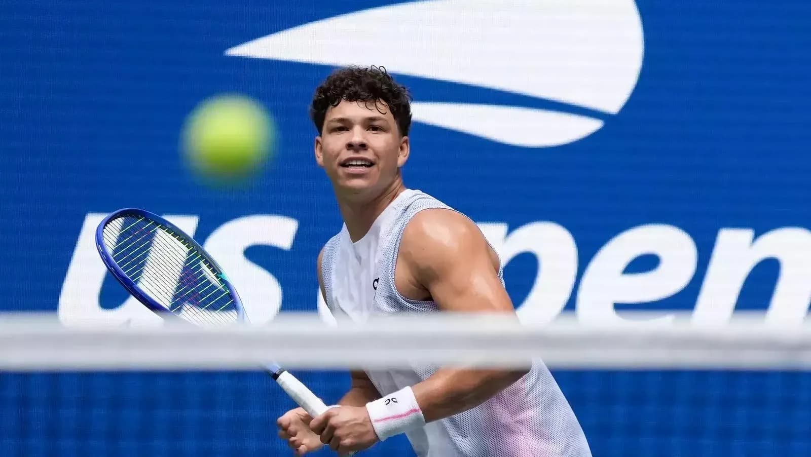 Tennis player preparing to hit a ball during match Tennis player preparing to hit a ball during match
