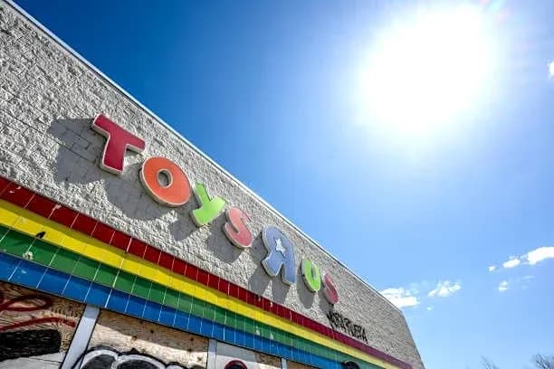 Exterior of a Toys R Us store with colorful signage Exterior of a Toys R Us store with colorful signage